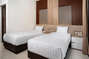 Letto o letti in una camera di The Amrta Borobudur