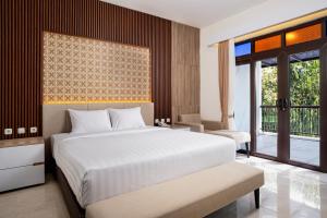 Letto o letti in una camera di The Amrta Borobudur