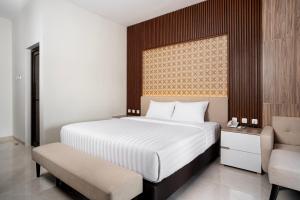 Letto o letti in una camera di The Amrta Borobudur