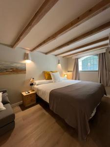 Postel nebo postele na pokoji v ubytování Calendula Hotel & Apartaments