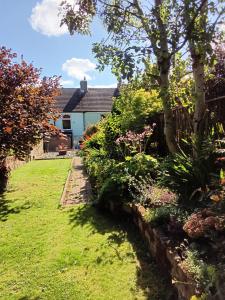 a garden of a house with a fence at Foresters Guest House Ltd in Crook