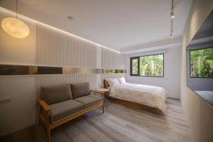 Ένα ή περισσότερα κρεβάτια σε δωμάτιο στο Yong Li Hotel