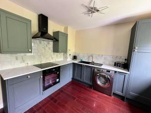 Η κουζίνα ή μικρή κουζίνα στο Hazelloft Apartment