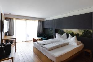 Posteľ alebo postele v izbe v ubytovaní Sonne Mellau - Feel good Hotel