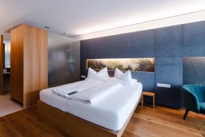 Posteľ alebo postele v izbe v ubytovaní Sonne Mellau - Feel good Hotel
