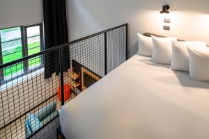 Ein Bett oder Betten in einem Zimmer der Unterkunft CX Milan Bicocca