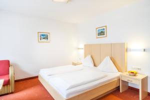 Łóżko lub łóżka w pokoju w obiekcie Hotel Glasererhaus