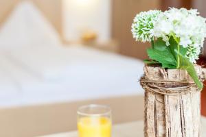 Łóżko lub łóżka w pokoju w obiekcie Hotel Glasererhaus