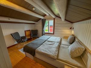 a bedroom with a large bed in a room at Stugan in Ekshärad