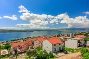 an aerial view of a town with a body of water at Klara in Crikvenica +22 photos