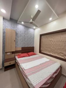 Ένα ή περισσότερα κρεβάτια σε δωμάτιο στο Ichhedana Homestay in Santiniketan