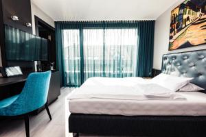 Postel nebo postele na pokoji v ubytování Hotel Der Blaue Reiter