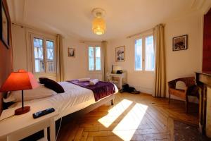 En eller flere senge i et værelse på Rouen Hôtel de Ville - Chez Eric