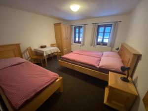 Ein Bett oder Betten in einem Zimmer der Unterkunft Penzion Ida