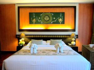 Llit o llits en una habitació de Mountain Creek Wellness Resort Chiangmai