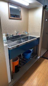 a kitchen with a sink in a room at Ryokan Nakadaya in Tokyo +37 photos