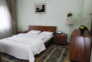 Ein Bett oder Betten in einem Zimmer der Unterkunft Vip Apart Hotel