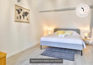 Posteľ alebo postele v izbe v ubytovaní Appartements duplex 3 et 4 personnes - Climatisation - Village élu parmi les "Plus Beaux Villages de France" - Route des Vins - Centre Alsace