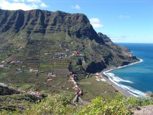 an aerial view of a mountain next to the ocean at Casa Rural La Cuadra in Hermigua