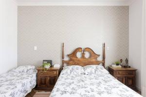a bedroom with two beds and two wooden dressers at Sítio da malva in Sorocaba +24 photos