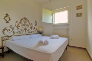 Ένα ή περισσότερα κρεβάτια σε δωμάτιο στο Lalla al Lago Pool - Access, Parking, Lake Views