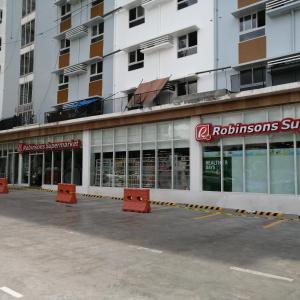 a store front of a building with a lot of windows at Casa Mira Guadalupe Harmony Home Cebu City in Cebu City +6 photos