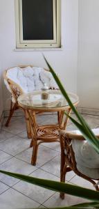 a table and a chair in a room at B&B Sa Clarera in Baunei