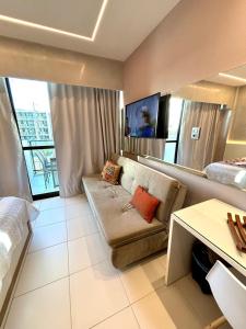 Et tv og/eller underholdning på MAKIA beach 115B Flat em Muro Alto PE + 17 billeder