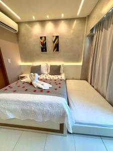 En eller flere senge i et værelse på MAKIA beach 115B Flat em Muro Alto PE