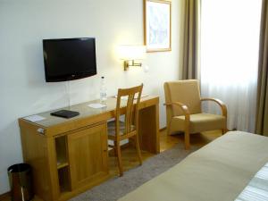 Телевизор и/или развлекательный центр в Hotel Boa - Vista