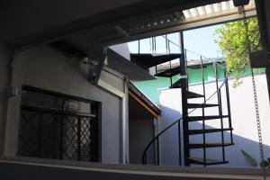 a view of a building with a spiral staircase at HOSTEL ErreJota in Jaguariúna