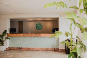 a waiting room with a green sign on the wall at Costa Sur All Inclusive Resort in Puerto Vallarta +168 photos
