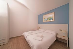Postel nebo postele na pokoji v ubytování Hotel Residence Panorama La Forca, GTSGroup