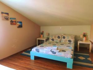 Postel nebo postele na pokoji v ubytování Sunset Apartments