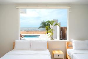 Postel nebo postele na pokoji v ubytování The La Palma Villa Kuiburi + 37 fotografií