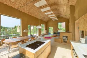 a kitchen and dining room with a table and chairs at Elegant holiday residence with privat sauna close to Baltic Sea on Wolin Island in Wisełka +55 photos