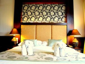Postelja oz. postelje v sobi nastanitve Mountain Creek Wellness Resort Chiangmai
