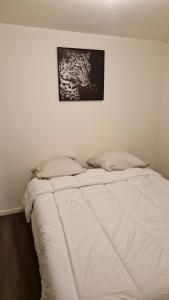 Ένα ή περισσότερα κρεβάτια σε δωμάτιο στο Appartement meublé