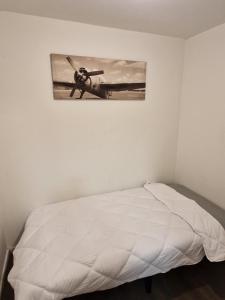 Ένα ή περισσότερα κρεβάτια σε δωμάτιο στο Appartement meublé