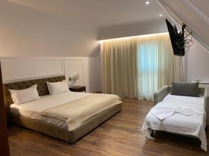 Voodi või voodid majutusasutuse Hotel Vila Zeus toas