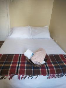 Cama ou camas em um quarto em Guanaaní Hostel