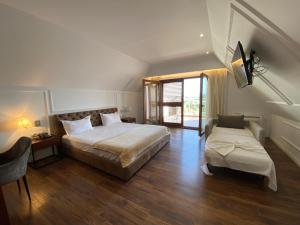 Voodi või voodid majutusasutuse Hotel Vila Zeus toas