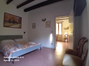 a bedroom with a bed and a living room at Panigale90 in Bologna +11 photos