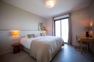 Ένα ή περισσότερα κρεβάτια σε δωμάτιο στο Villa vue mer Cap Corse +38 φωτογραφίες