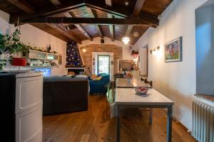 a living room with a table and a couch at Chalet Battista Grotte di Frasassi in Fabriano
