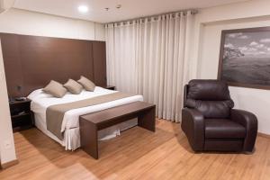 Postel nebo postele na pokoji v ubytování Olavo Bilac Hotel