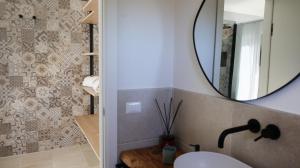 a bathroom with a sink and a mirror at BeB Villa Pacifica in Peschici