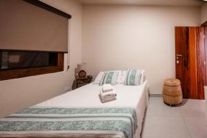 Ένα ή περισσότερα κρεβάτια σε δωμάτιο στο Pousada Hymbe