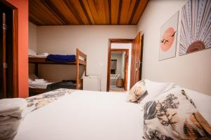 Ένα ή περισσότερα κρεβάτια σε δωμάτιο στο Pousada Hymbe