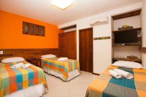 Cama ou camas em um quarto em Marauba Beach House - Taipu de Fora